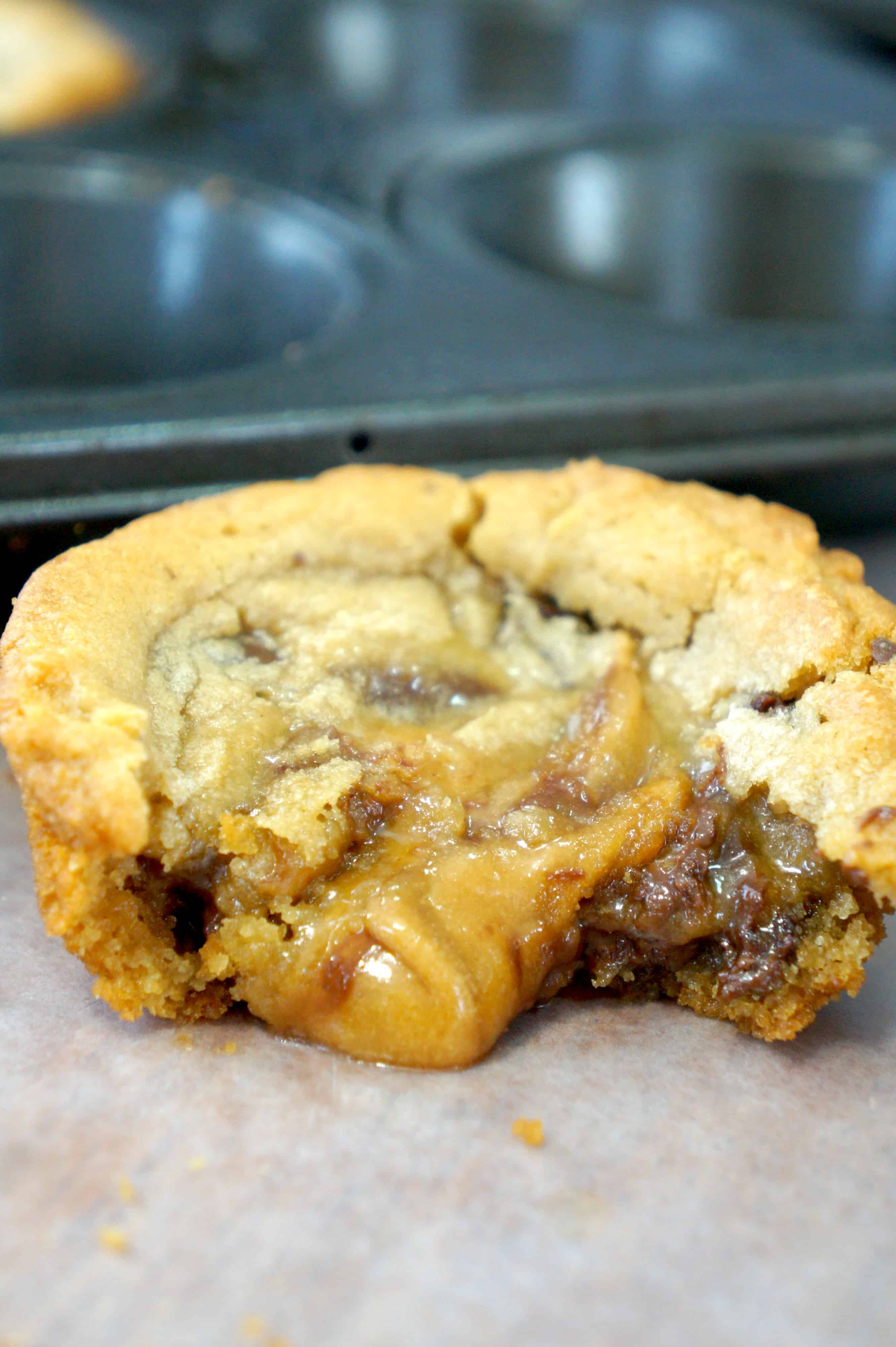 Chocolate Chip Cookies stuffed with Caramel and Chocolate Cream Cheese. Easy dessert recipe using Pillsbury chocolate chip cookie dough. Chocolate chip cookie cups made in muffin tins are an easy cream cheese dessert recipe.