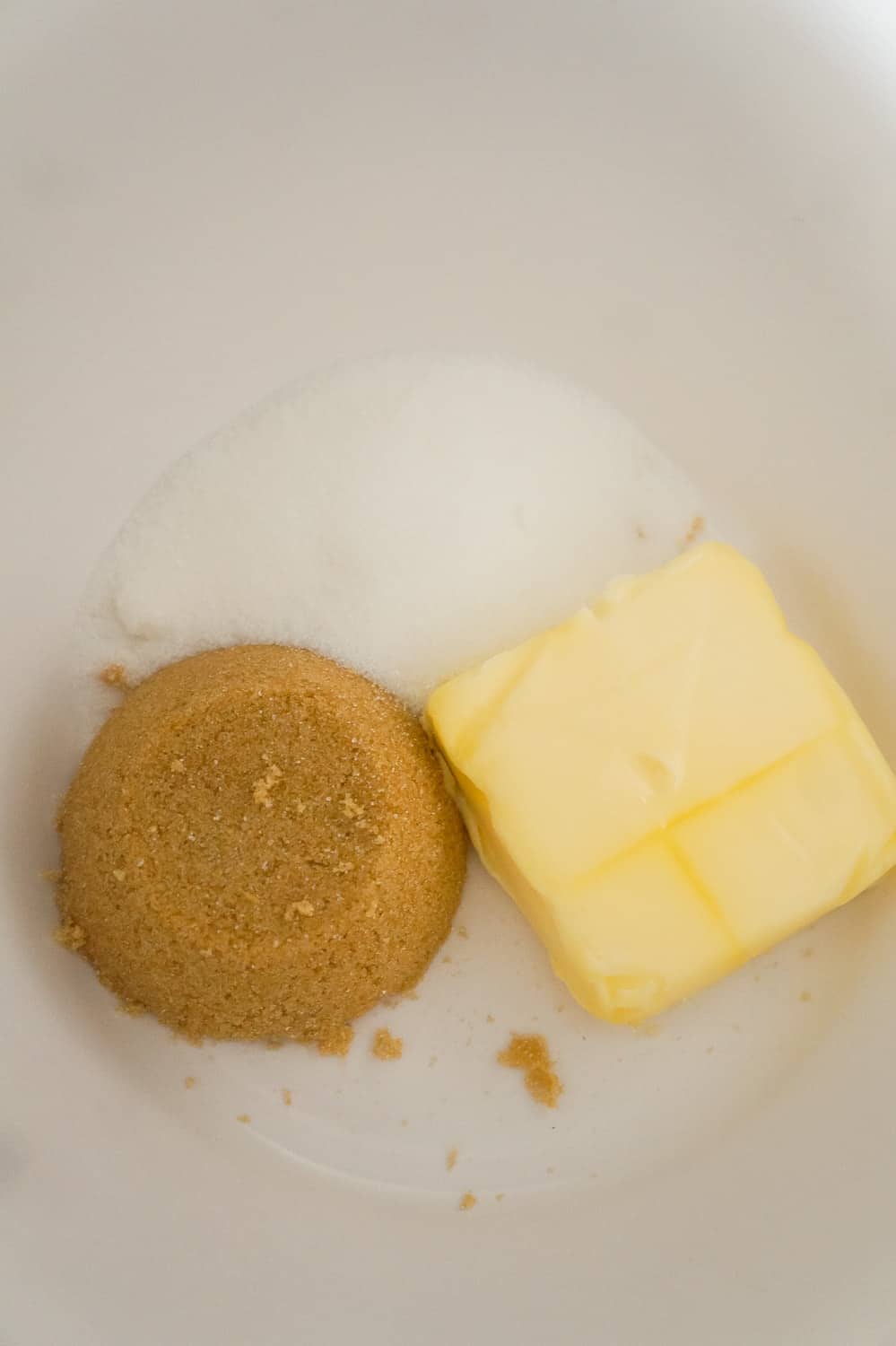 brown sugar, granulated sugar and butter in a mixing bowl