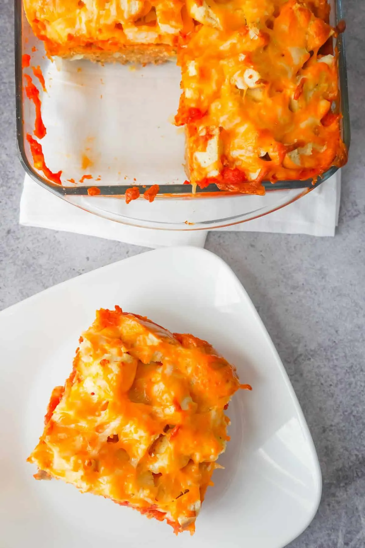 Easy Ground Chicken Casserole is a hearty ground chicken recipe topped with marinara sauce, garlic bagel chunks and shredded cheese.