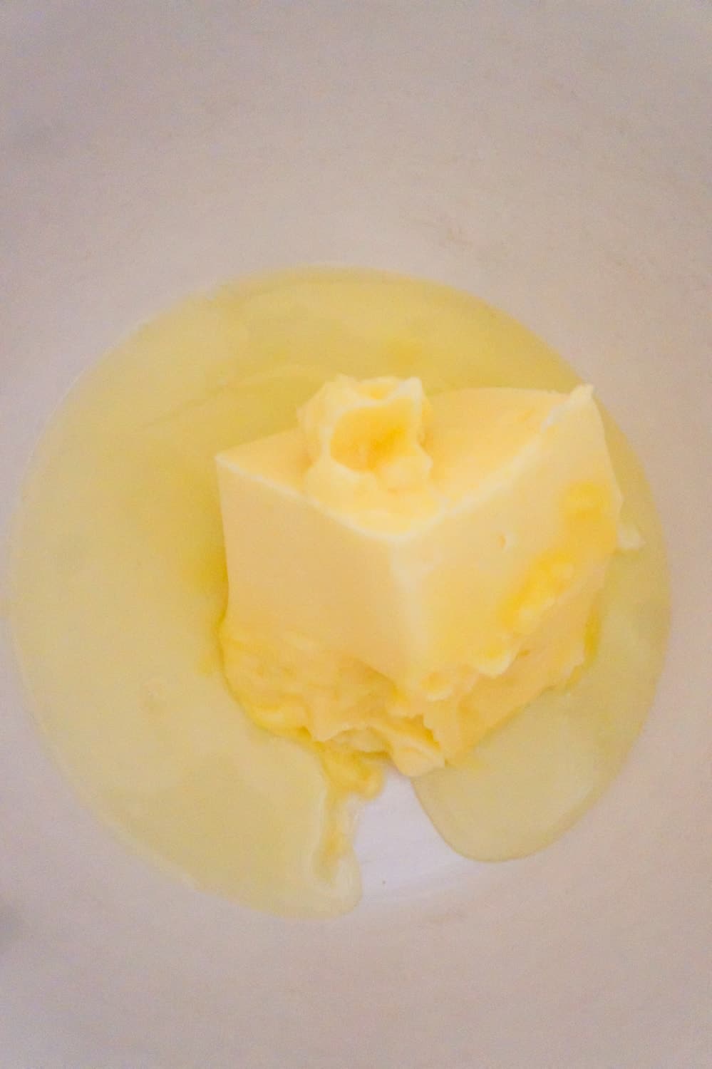 softened butter and egg white in a mixing bowl