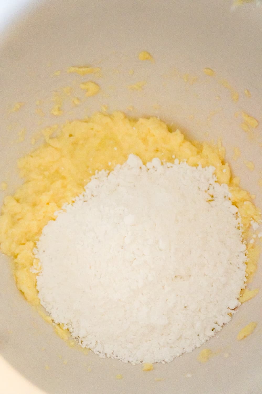 icing sugar on top of butter and egg white mixture