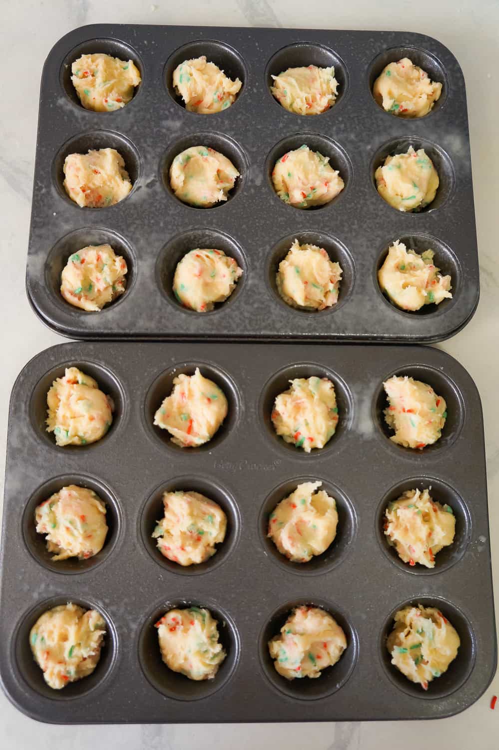 sugar cookie dough in mini muffin tins