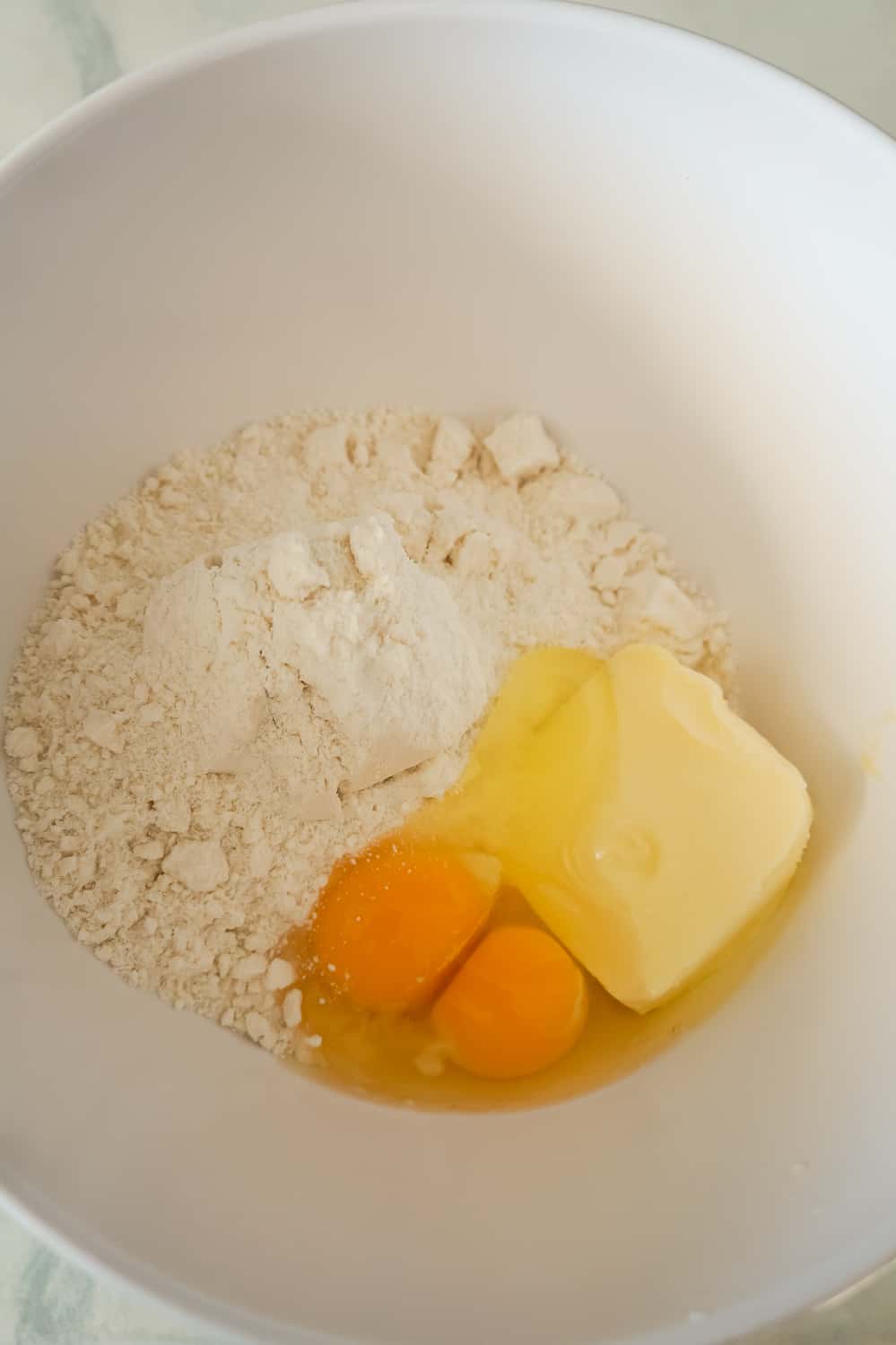 sugar cookie mix, butter and eggs in a mixing bowl