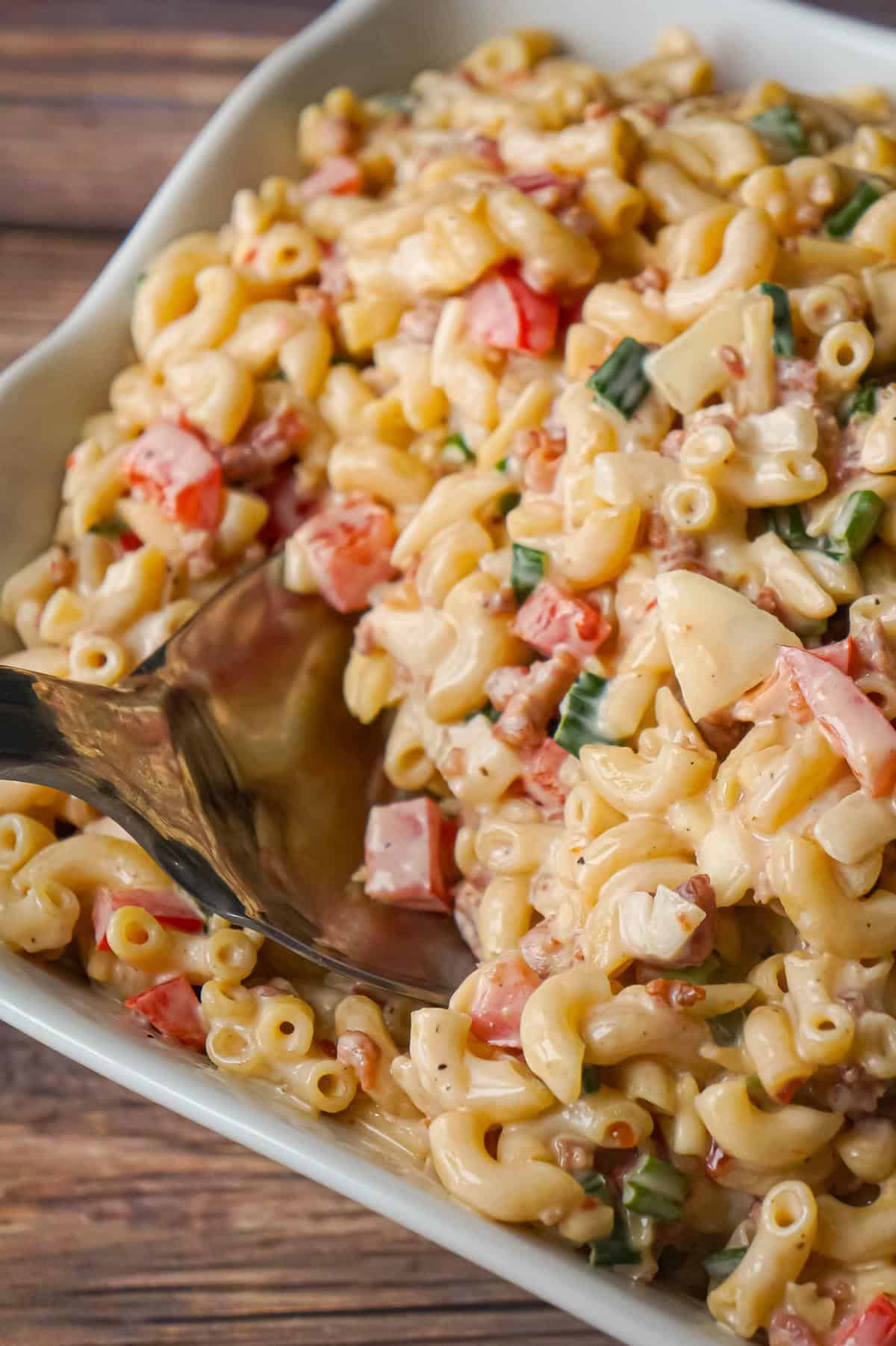 Sweet Chili Bacon Pasta Salad is an easy macaroni salad recipe loaded with bacon, chopped green onions, diced red peppers and slivered almonds all tossed in mayo and Thai sweet chili sauce.