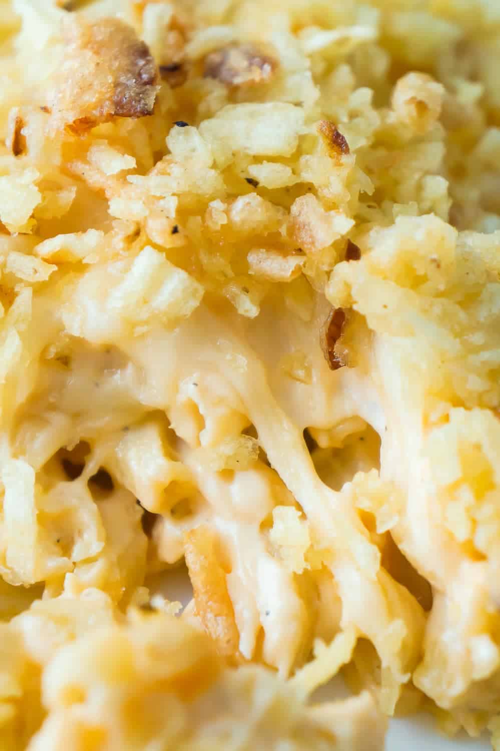 Baked Mac and Cheese with Potato Chip Topping can be either an easy dinner recipe or side dish recipe. This creamy macaroni and cheese is loaded with cheddar cheese, mozzarella and cream cheese, and topped with rippled potato chips and French's fried onions.