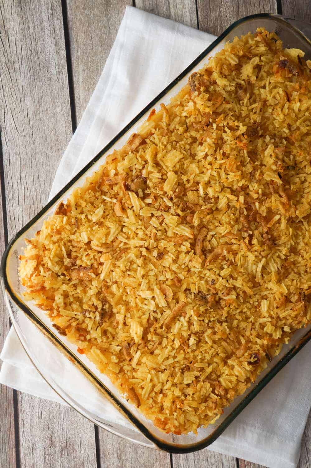 Baked Mac and Cheese with Potato Chip Topping can be either an easy dinner recipe or side dish recipe. This creamy macaroni and cheese is loaded with cheddar cheese, mozzarella and cream cheese, and topped with rippled potato chips and French's fried onions.