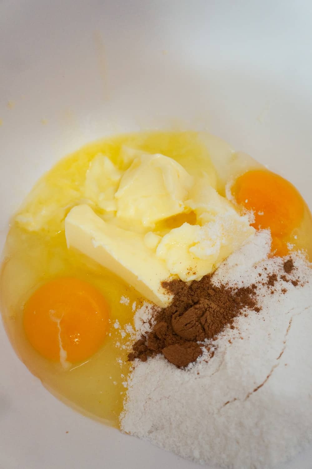 eggs, butter, pumpkin pie spice and vanilla pudding mix in mixing bowl