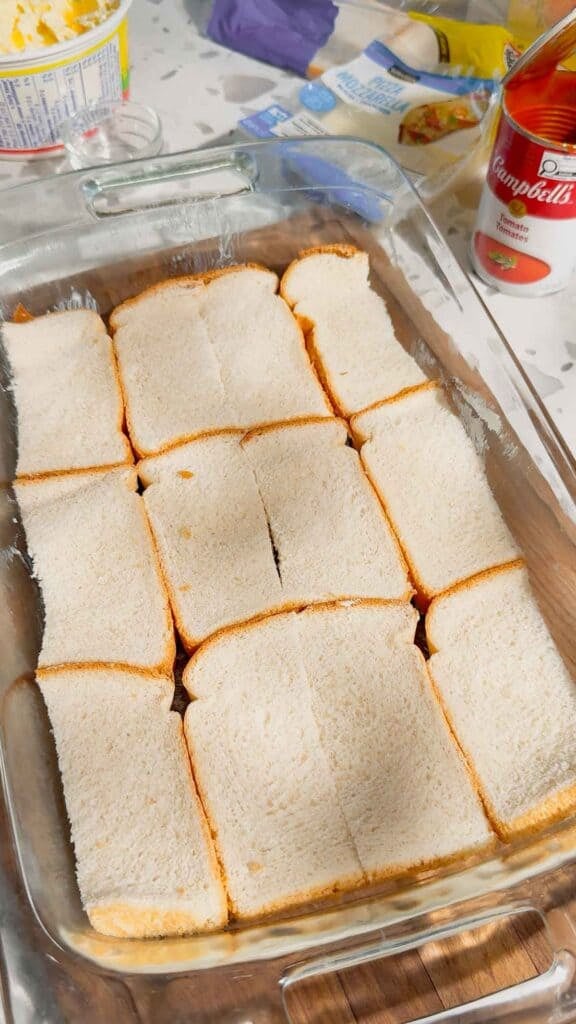 slices of butter bread in a baking dish