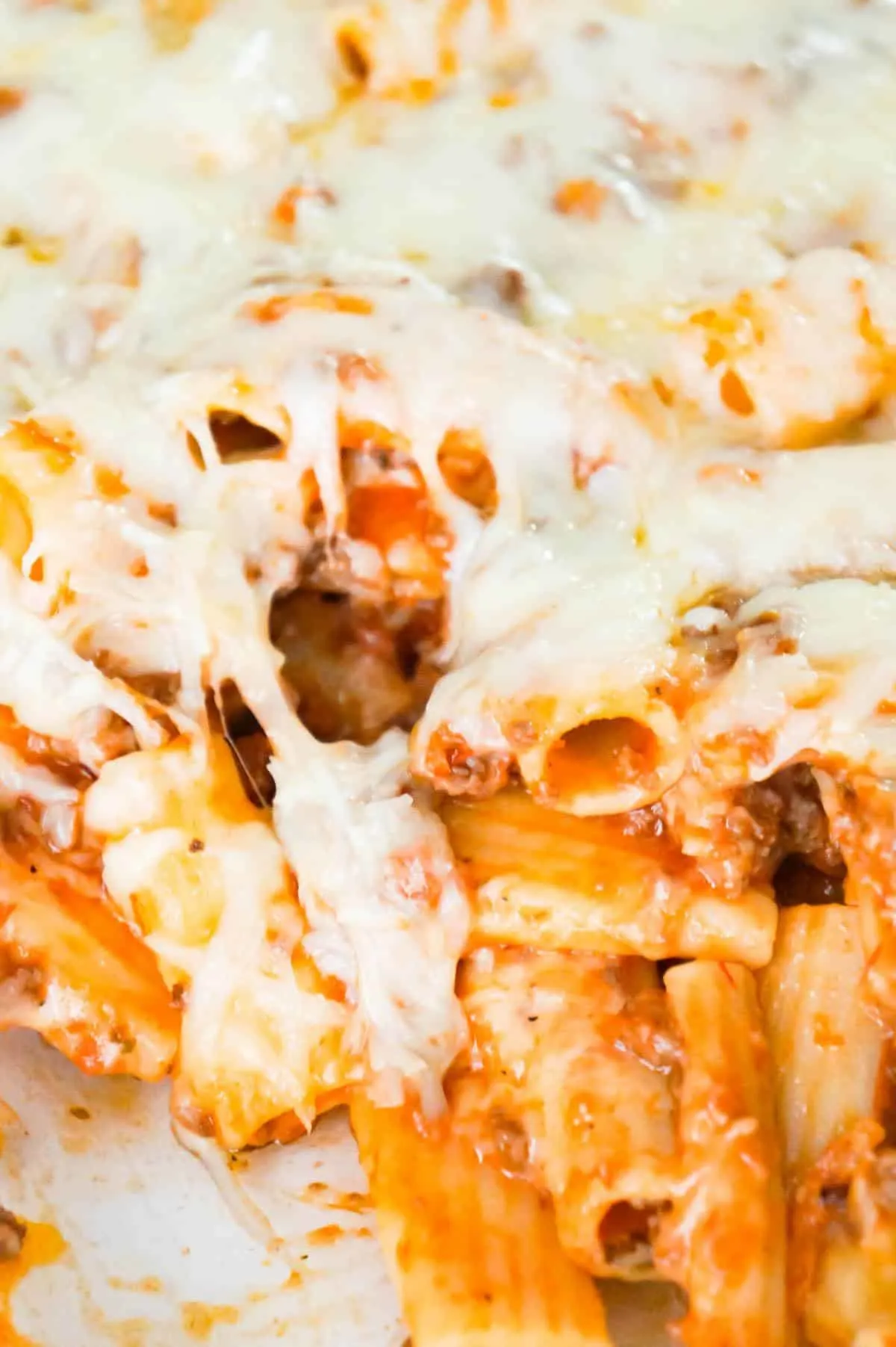 Baked Rigatoni Bolognese is a delicious pasta recipe loaded with ground beef, marinara and baked with mozzarella and Parmesan cheese.
