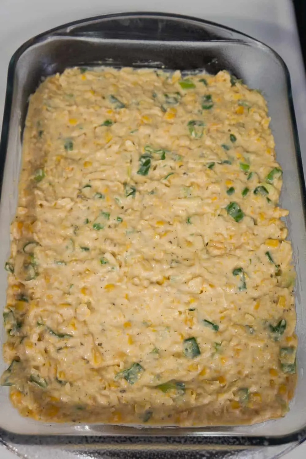 uncooked corn casserole mixture in a baking dish