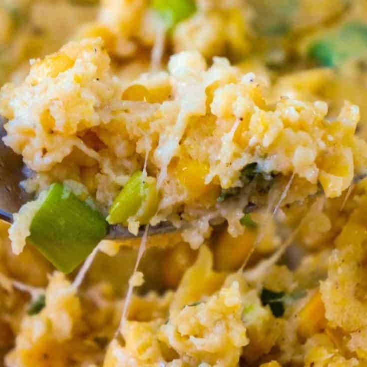 Corn Casserole with Cream Cheese is an easy side dish recipe perfect for holiday dinners and potlucks. This cheesy corn casserole made with cornbread mix is loaded with green onions and Havarti cheese.