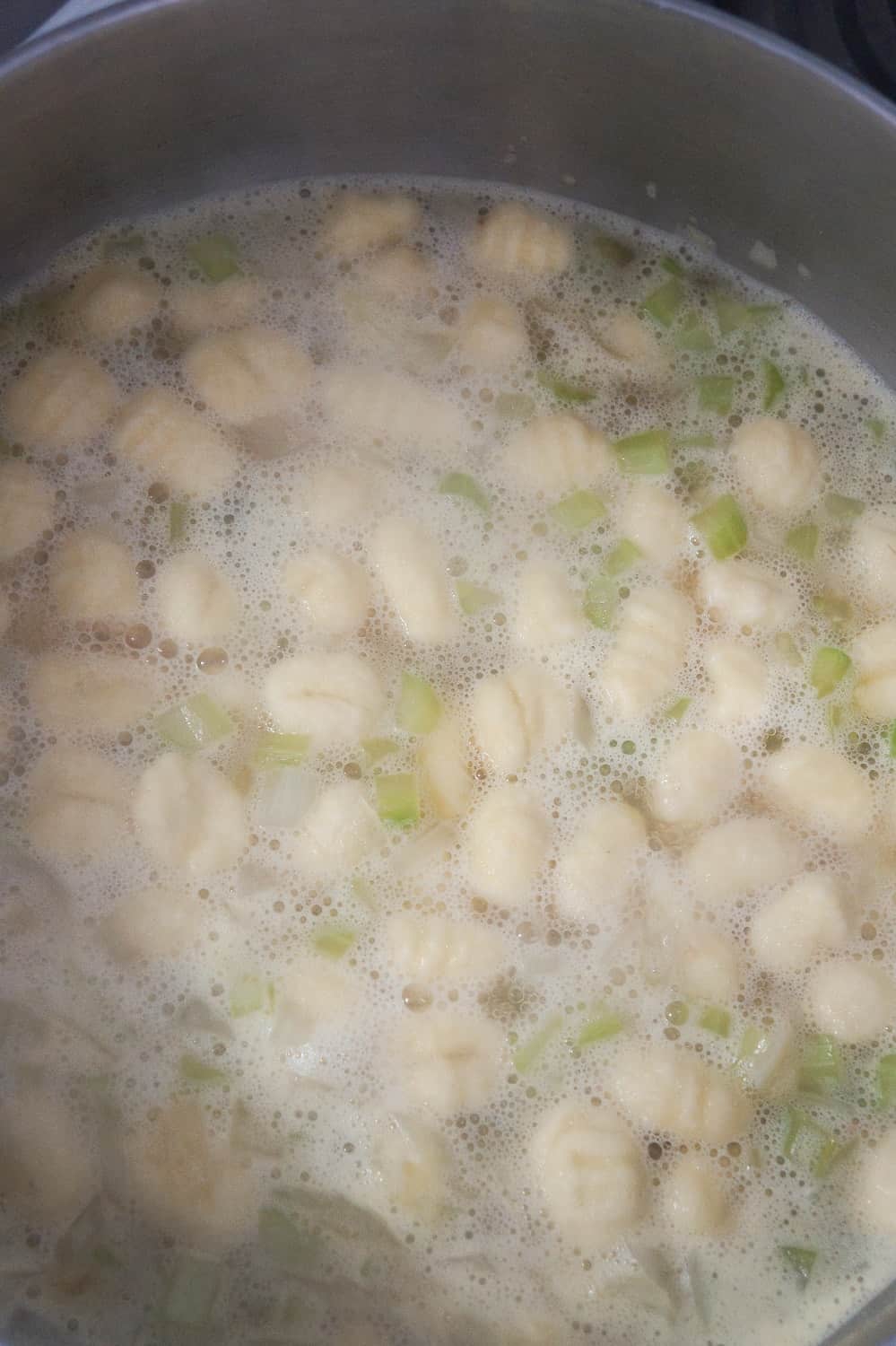 gnocchi floating in chicken broth