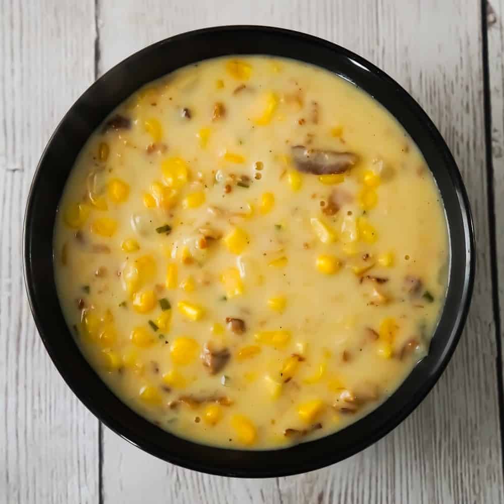 Easy Corn Chowder with Bacon is a hearty soup recipe perfect for cold weather. This creamy soup is loaded with corn and real bacon bits.