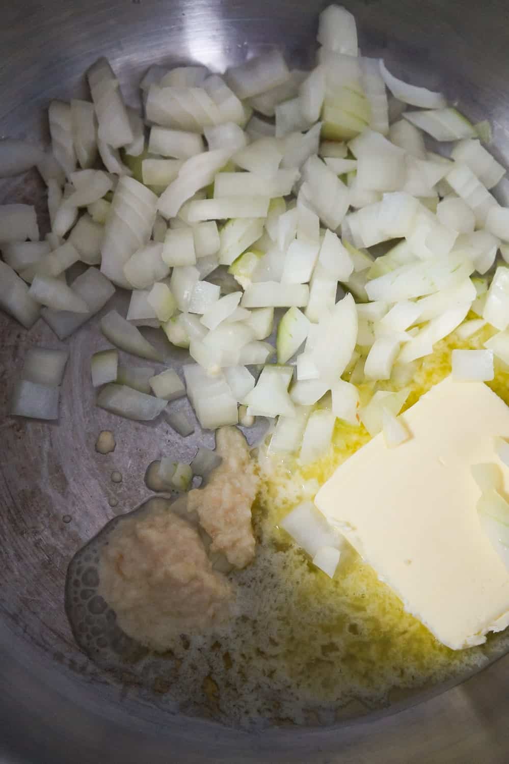 butter, diced onions and garlic puree in a soup pot
