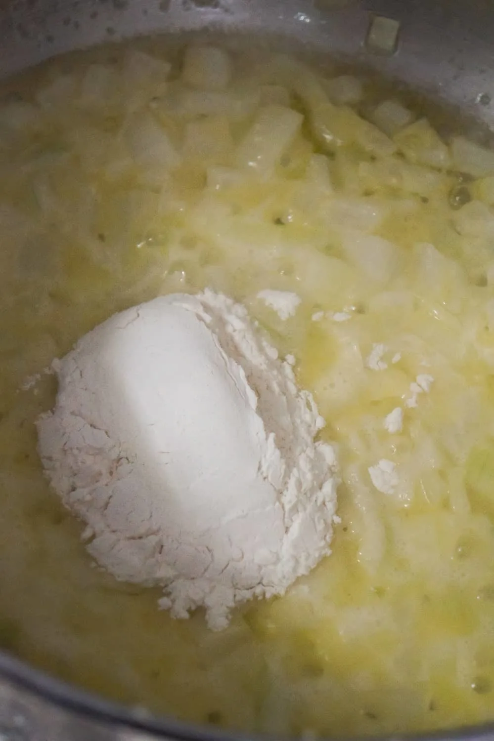 flour added to diced onions and butter in soup pot