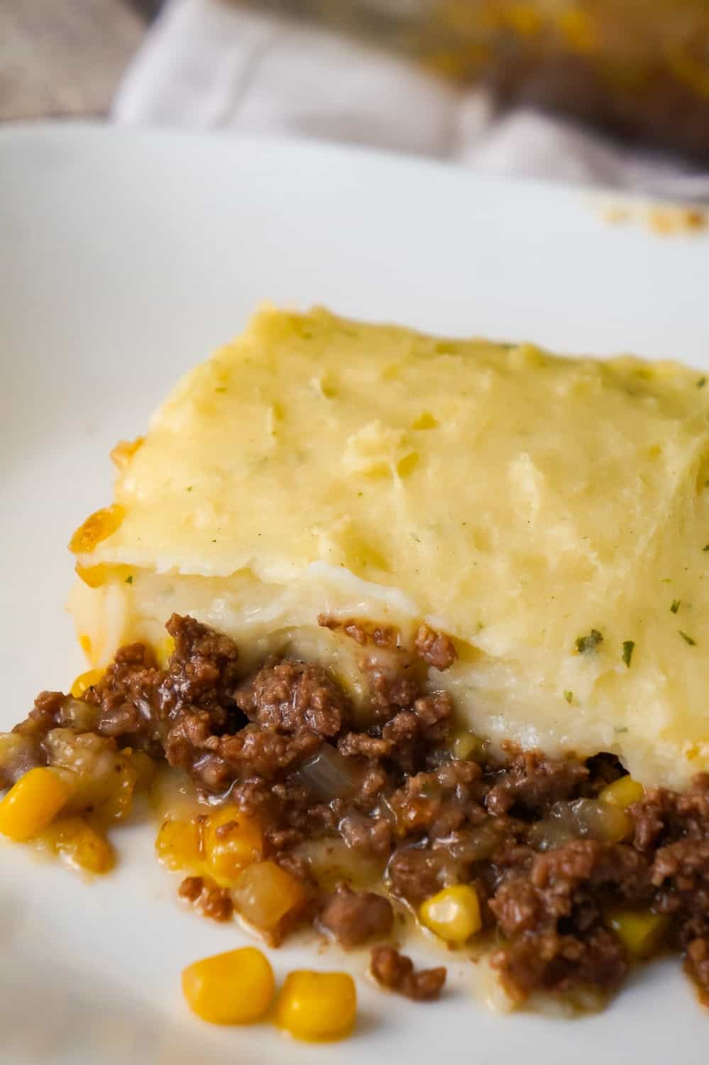 The Best Shepherd's Pie is an easy ground beef dinner recipe. A base of ground beef tossed in brown gravy is topped with corn and creamy mashed potatoes.