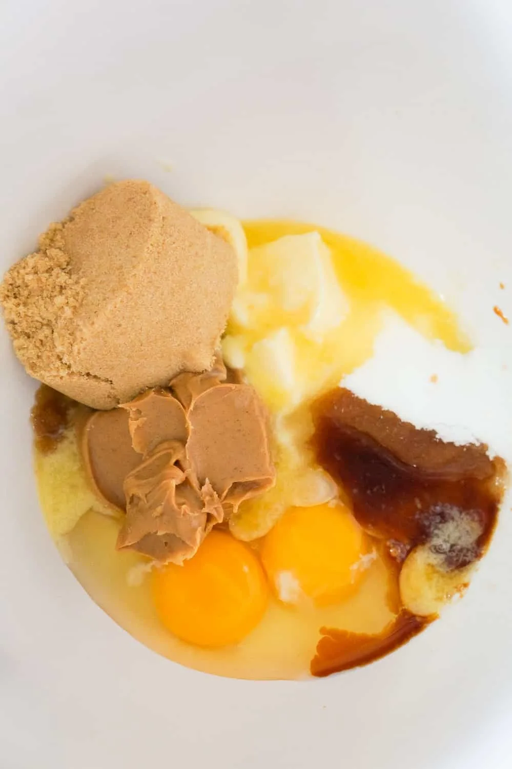 brown sugar, eggs peanut butter, butter and vanilla in a mixing bowl