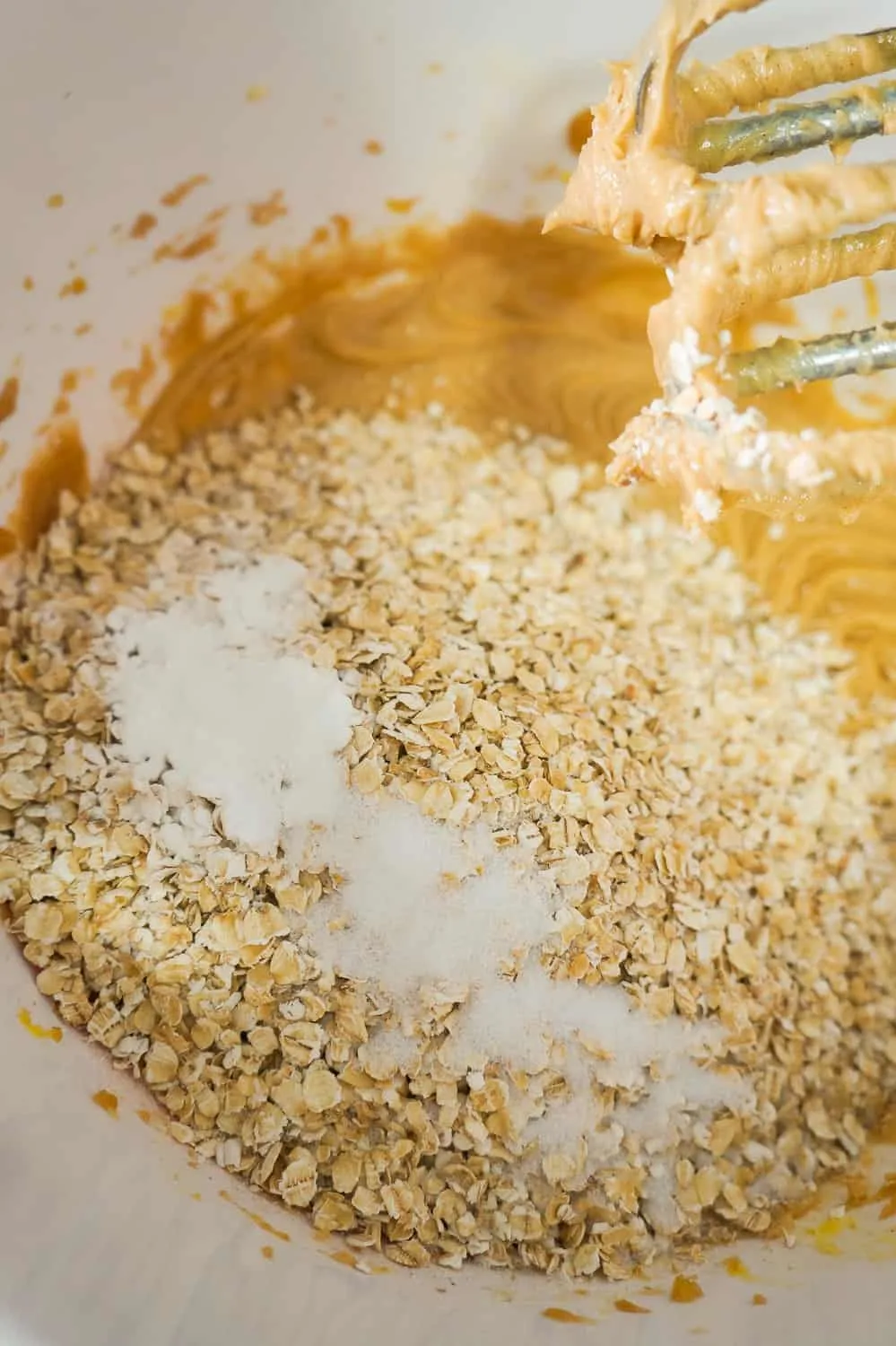quick oats, baking powder and salt added to peanut butter mixture