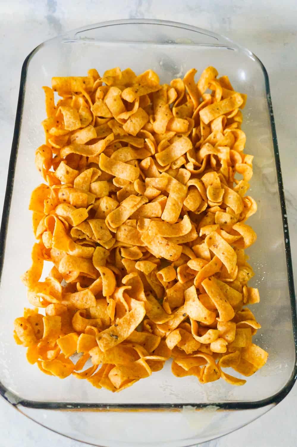 Frito's corn chips in a baking dish