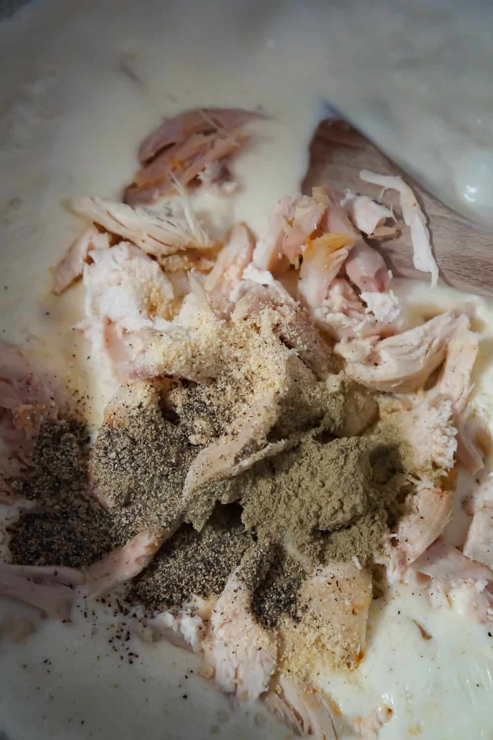 shredded chicken and spices added to a creamy sauce