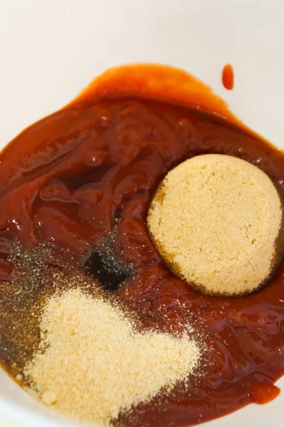 ketchup, brown sugar, worcestershire sauce and onion powder in a mixing bowl