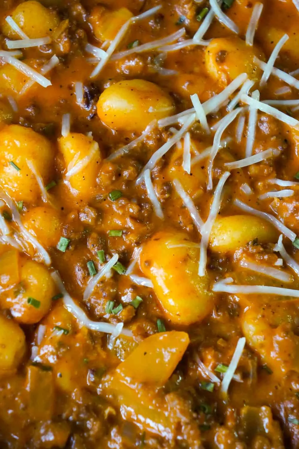 Gnocchi and Ground Beef with Tomato Sauce is an easy weeknight dinner recipe that takes less than 30 minutes from start to finish. These delicious mini potato dumpling are tossed in a sauce made from condensed tomato soup, along with some ground beef and real bacon bits.