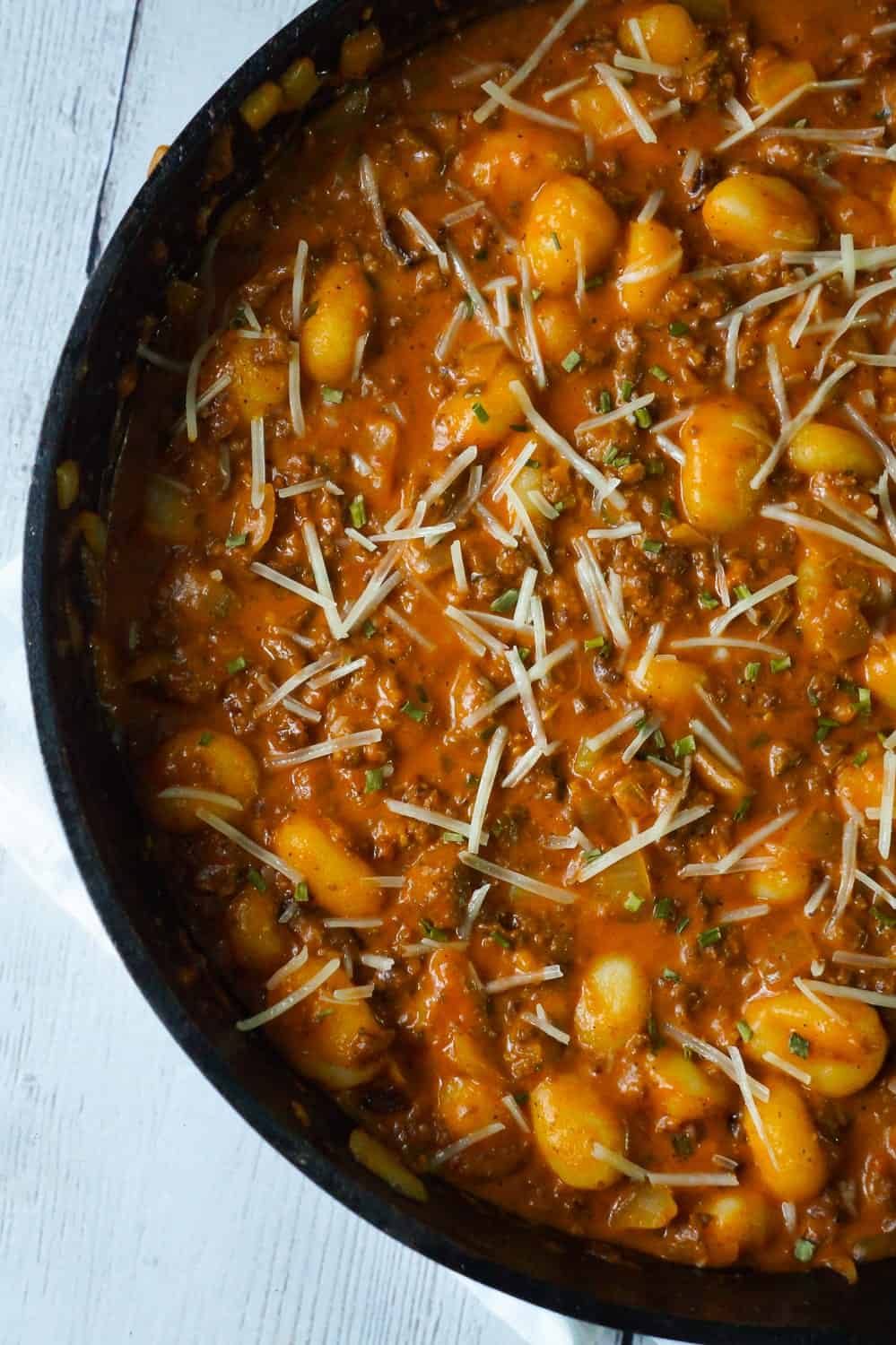 Gnocchi and Ground Beef with Tomato Sauce is an easy weeknight dinner recipe that takes less than 30 minutes from start to finish. These delicious mini potato dumpling are tossed in a sauce made from condensed tomato soup, along with some ground beef and real bacon bits.