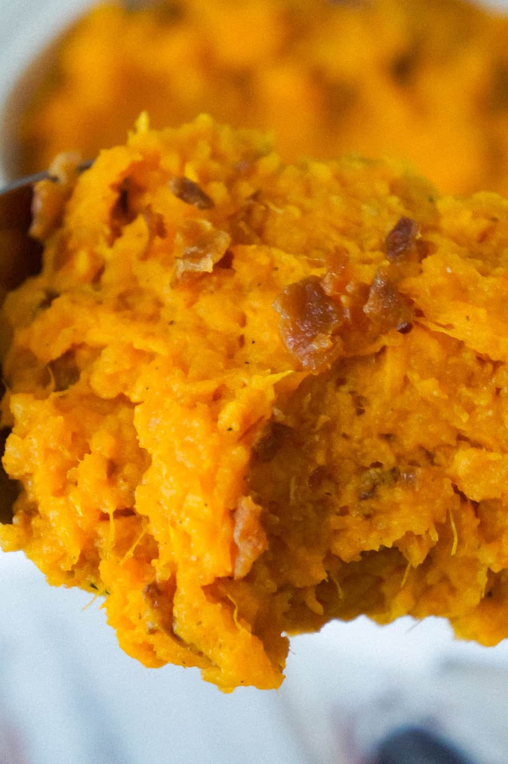 Maple Bacon Mashed Sweet Potatoes are an easy side dish recipe perfect for Thanksgiving. These mashed sweet potatoes are made with maple syrup and real bacon bits.