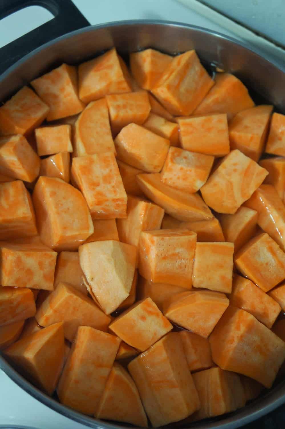 peeled and chopped sweet potatoes in a large pot of water