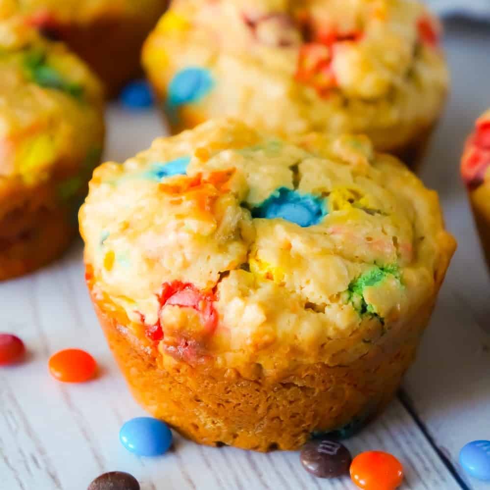 Monster Cookie Muffins are an easy breakfast or snack recipe made with cake mix. The peanut butter oatmeal muffins are loaded with mini M&Ms.