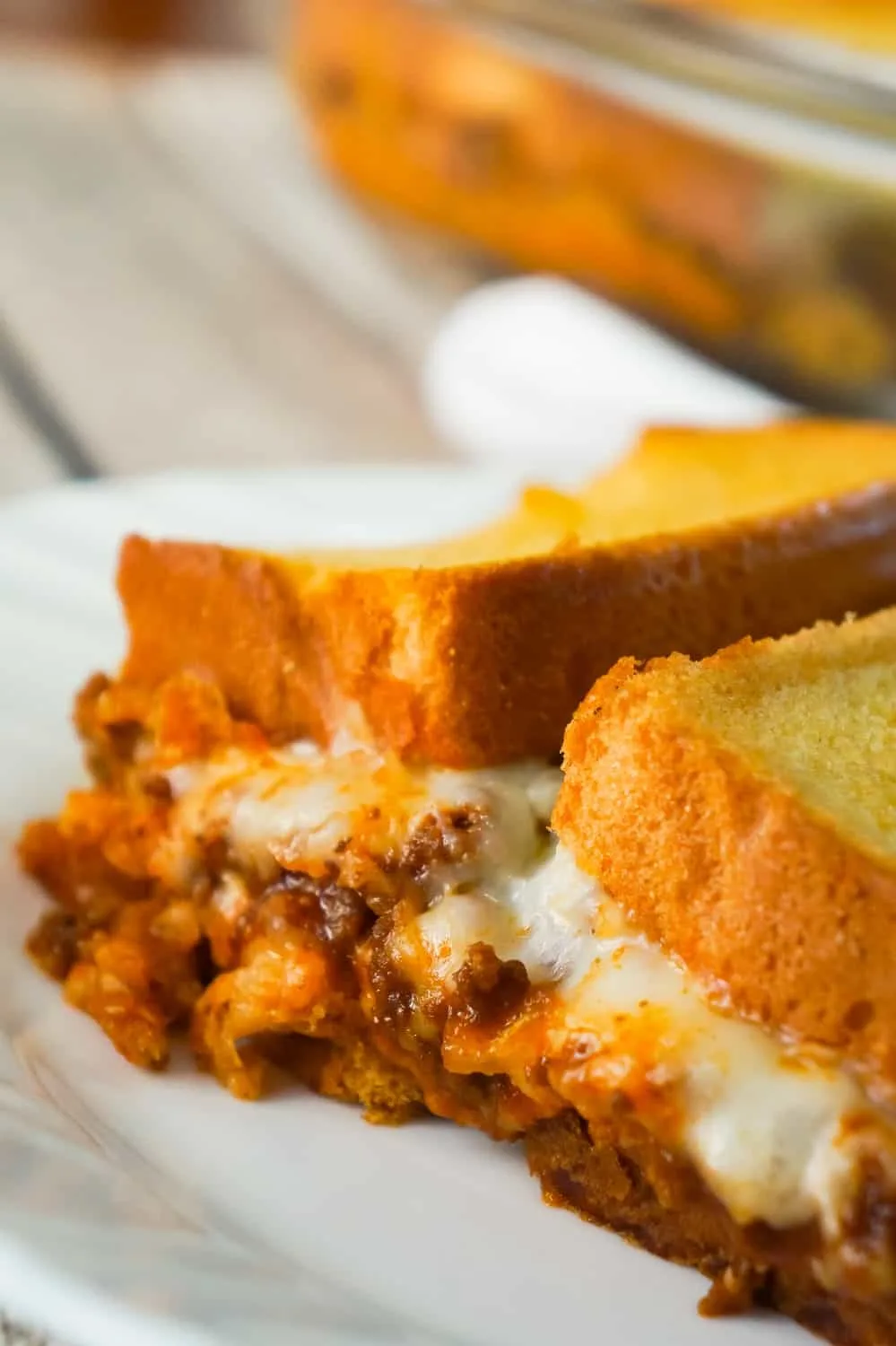 Sloppy Joe Grilled Cheese Casserole is an easy ground beef dinner recipe your whole family will love. This tasty casserole is loaded with mozzarella cheese and sloppy joe filling sandwiched between two layers of bread.