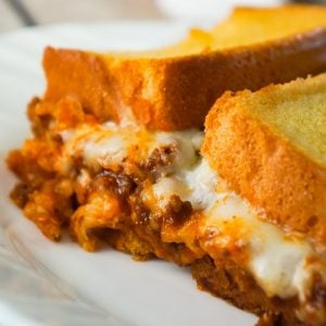 Sloppy Joe Grilled Cheese Casserole is an easy ground beef dinner recipe your whole family will love. This tasty casserole is loaded with mozzarella cheese and sloppy joe filling sandwiched between two layers of bread.