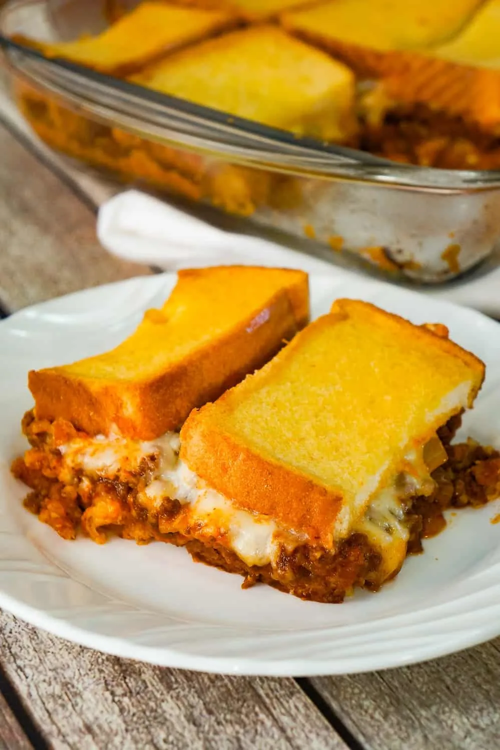 Sloppy Joe Grilled Cheese Casserole is an easy ground beef dinner recipe your whole family will love. This tasty casserole is loaded with mozzarella cheese and sloppy joe filling sandwiched between two layers of bread.