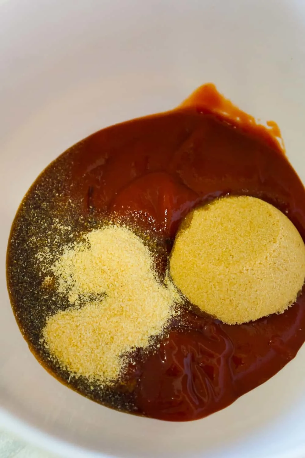 ketchup, Worcestershire sauce, onion powder, brown sugar, in a mixing bowl