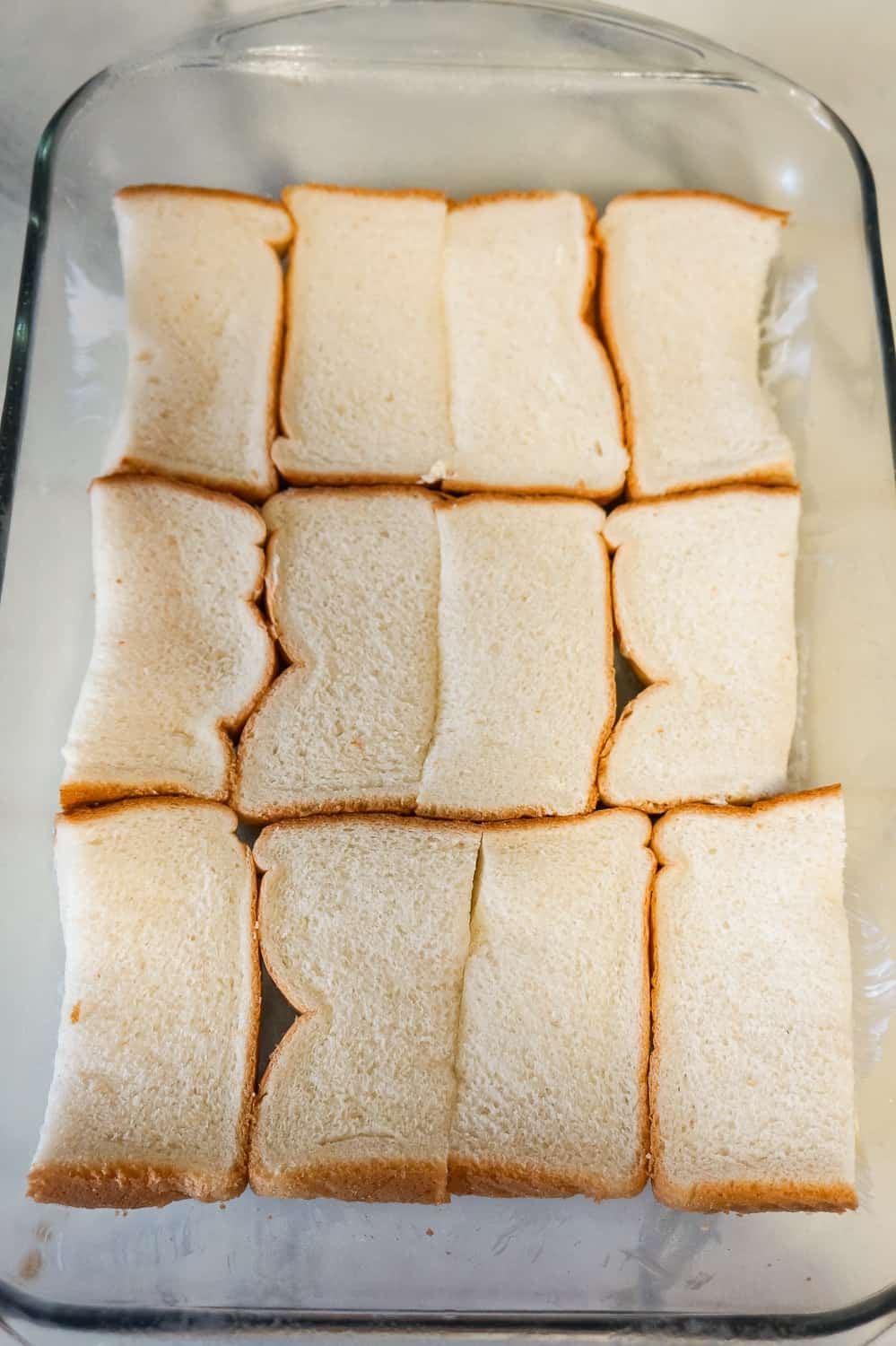 slices of bread in a a baking dish
