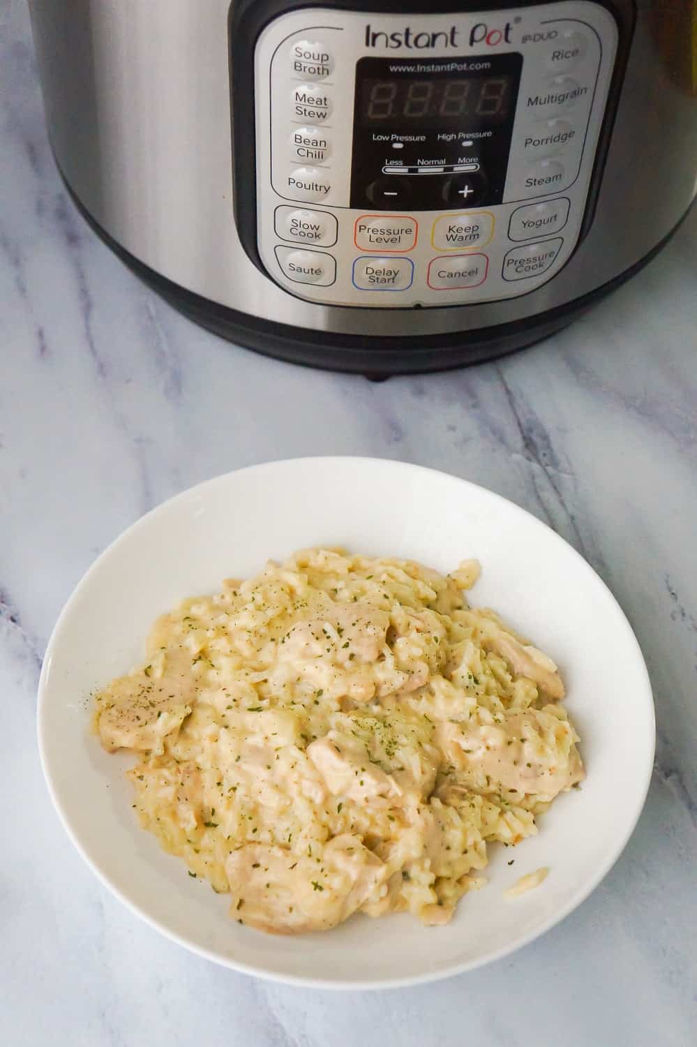 Instant Pot Garlic Parmesan Chicken and Rice is an easy chicken dinner recipe perfect for busy weeknights. This chicken dish is rich and creamy and loaded with Parmesan cheese.