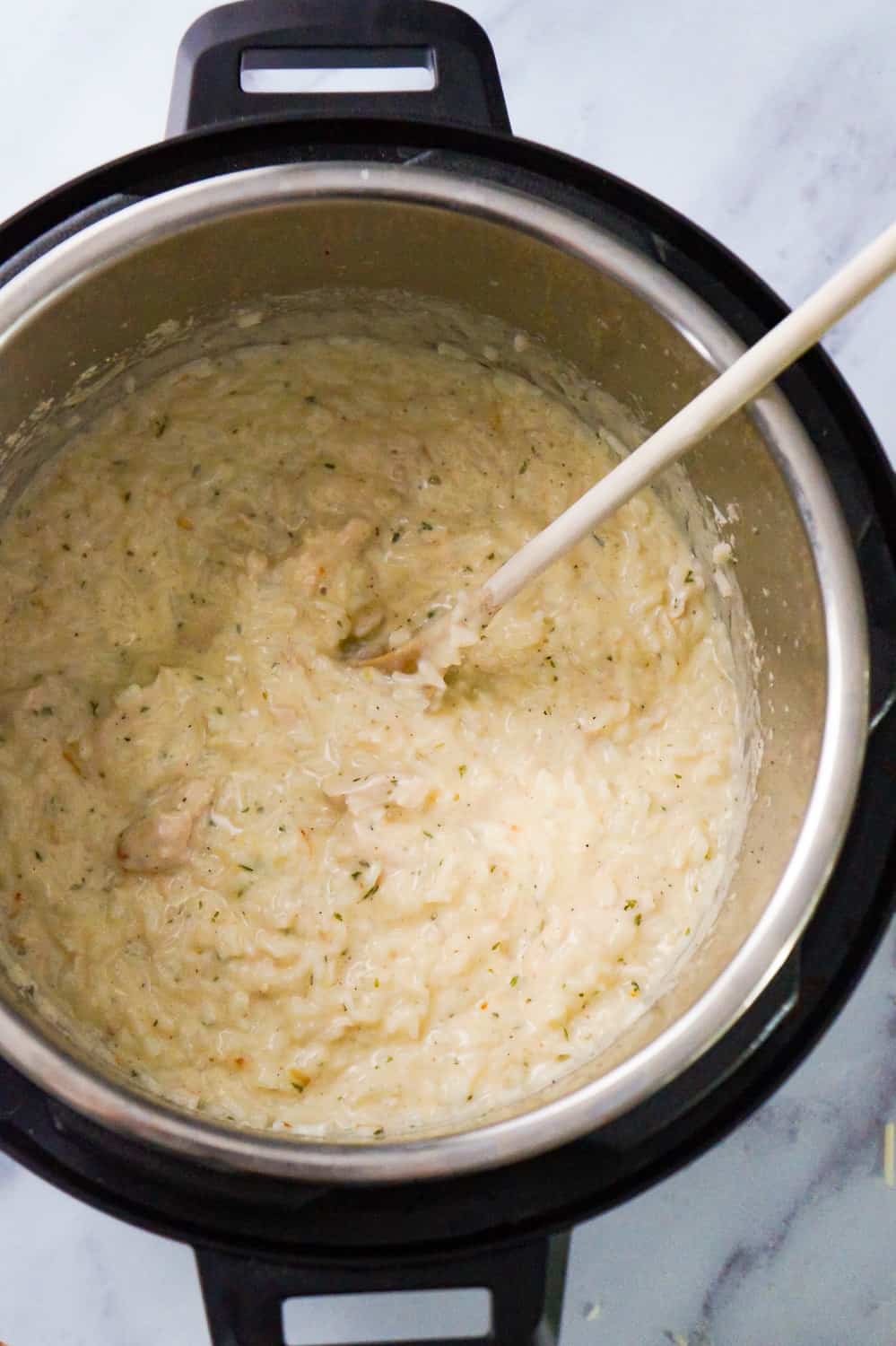 Instant Pot Garlic Parmesan Chicken and Rice is an easy chicken dinner recipe perfect for busy weeknights. This chicken dish is rich and creamy and loaded with Parmesan cheese.