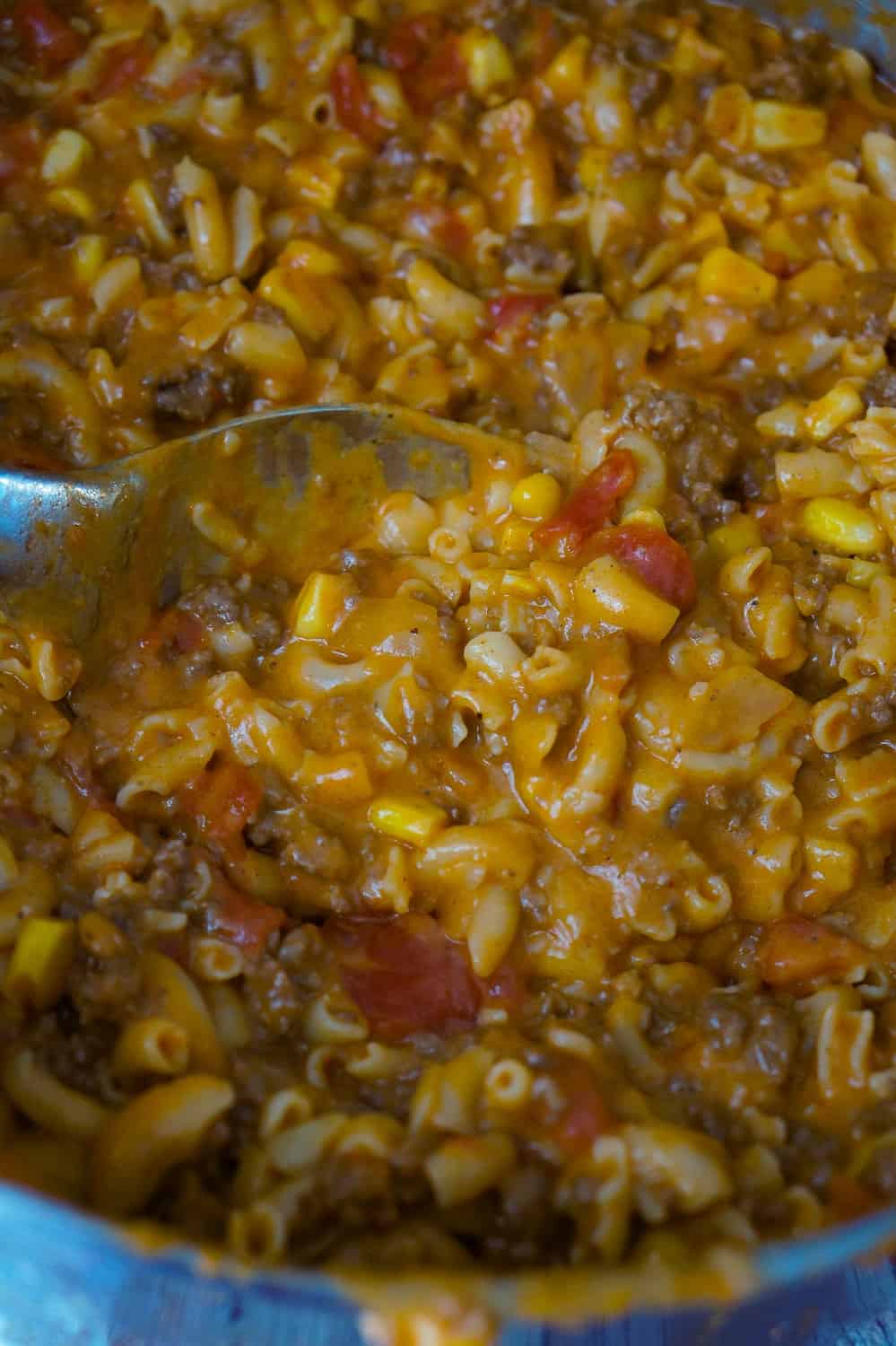 Cheesy Beef Goulash with Corn is an easy weeknight dinner recipe that takes less than 30 minutes from start to finish. This one pot dinner is loaded with diced tomatoes, macaroni noodles, ground beef corn and mozzarella cheese.