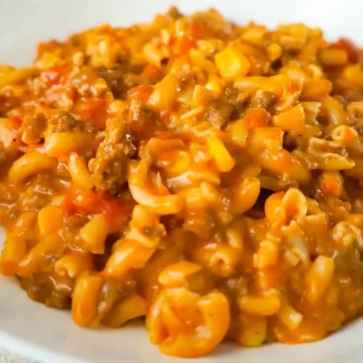 Cheesy Beef Goulash with Corn is an easy weeknight dinner recipe that takes less than 30 minutes from start to finish. This one pot dinner is loaded with diced tomatoes, macaroni noodles, ground beef corn and mozzarella cheese.