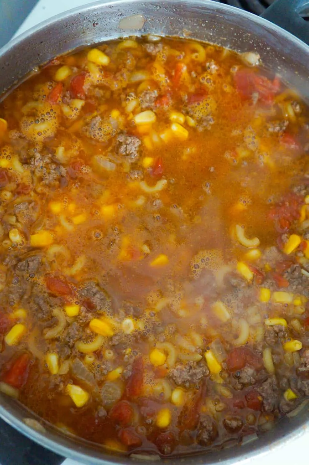 beef goulash simmering in a large pot