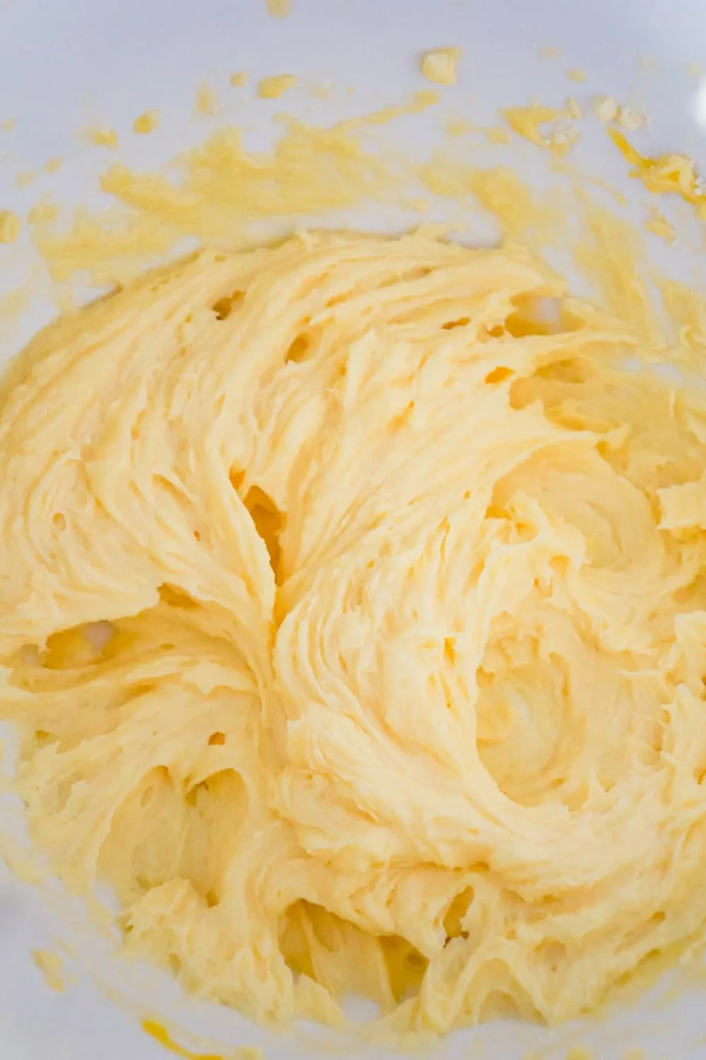 butter, eggs and vanilla instant pudding mix creamed together in a mixing bowl