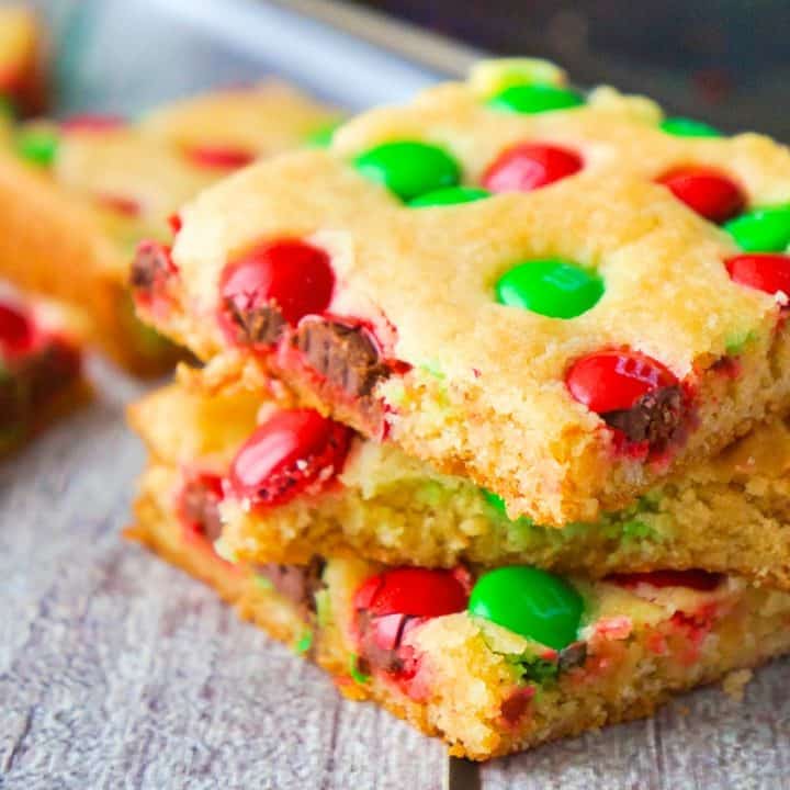 Christmas Cookie Bars are an easy holiday dessert recipe. These vanilla pudding sugar cookie bars are loaded with red and green M&M's.