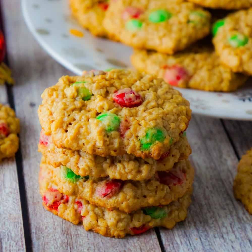 Christmas Monster Cookies are delicious oatmeal peanut butter cookies loaded with red and green M&Ms. These flourless oatmeal cookies would be the perfect addition to your Christmas baking.