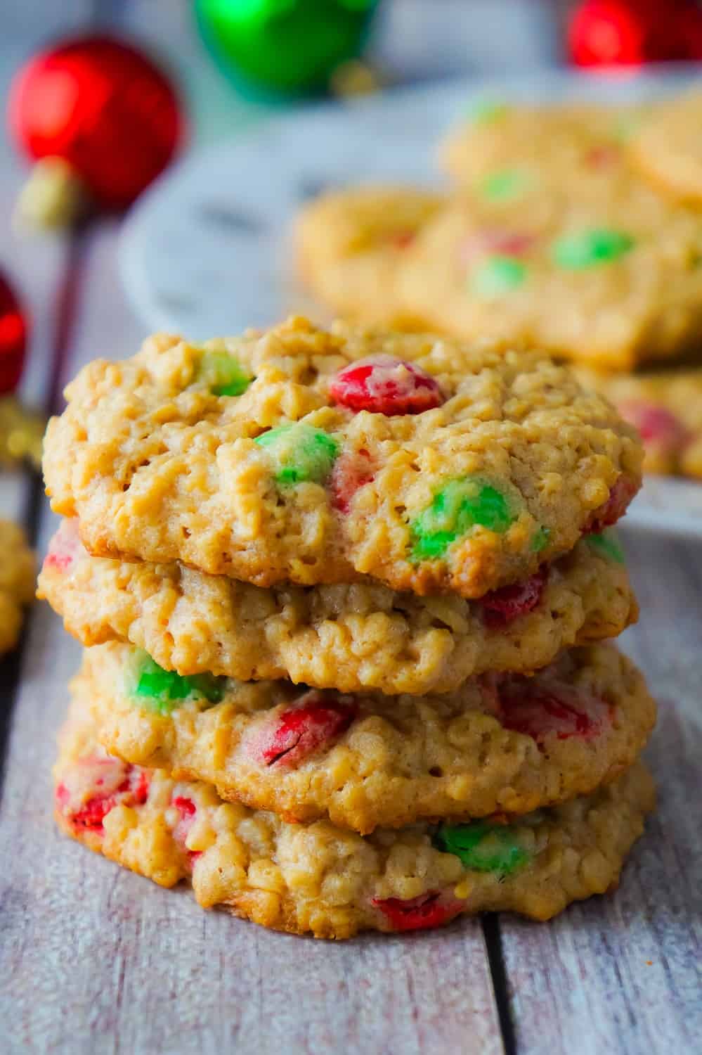 Christmas Monster Cookies are delicious oatmeal peanut butter cookies loaded with red and green M&Ms. These flourless oatmeal cookies would be the perfect addition to your Christmas baking.