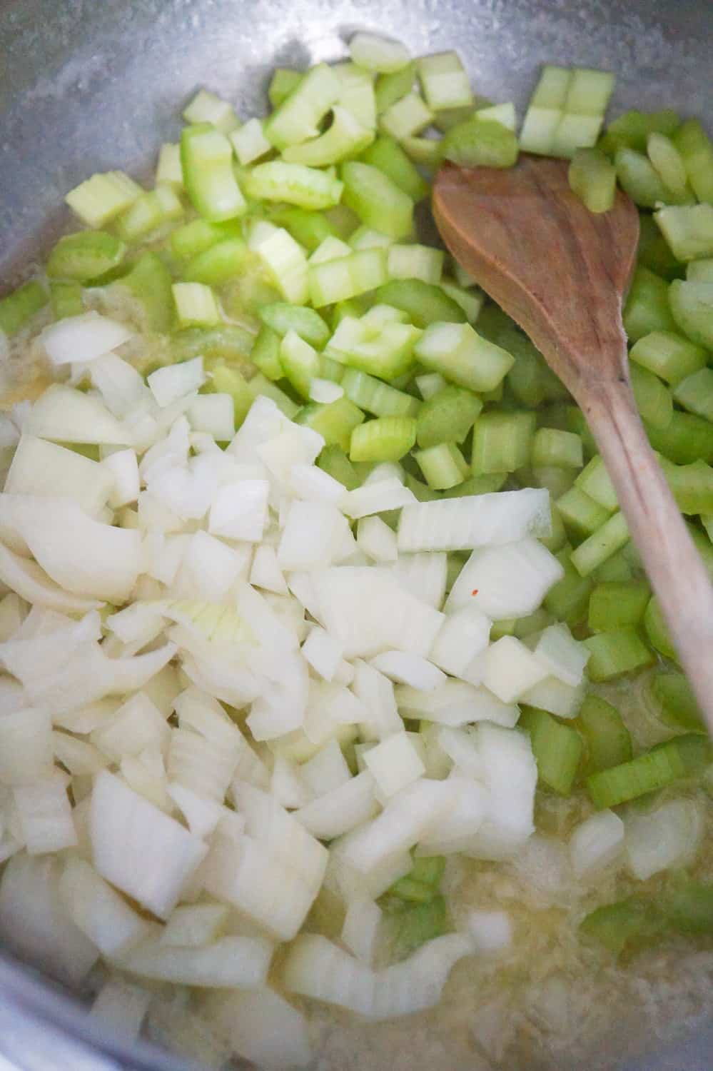 diced onions and diced celery in pot