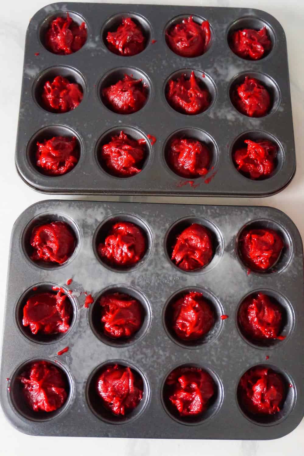 red velvet brownie batter in mini muffin tins