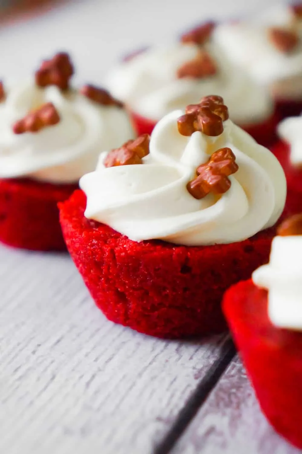 Red Velvet Brownie Bites are delicious mini desserts perfect for the holidays. These bite sized brownies are baked in mini muffin tins and topped with cream cheese frosting.