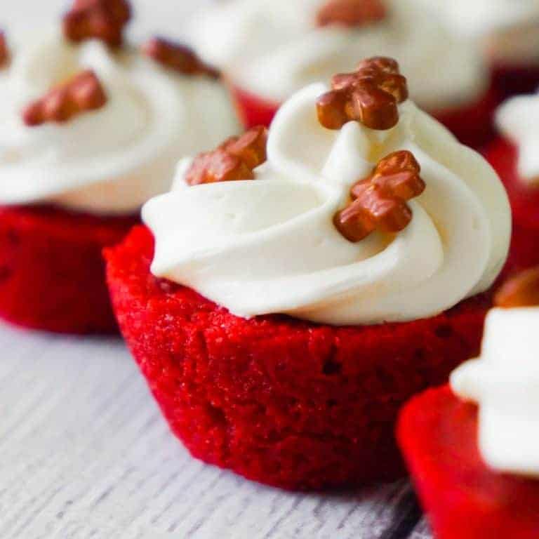Red Velvet Brownie Bites are delicious mini desserts perfect for the holidays. These bite sized brownies are baked in mini muffin tins and topped with cream cheese frosting.