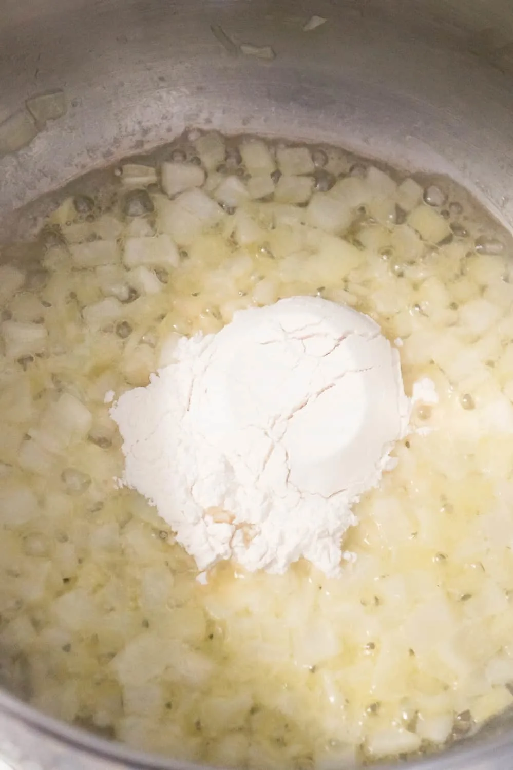 flour added to diced onions and butter in a large pot
