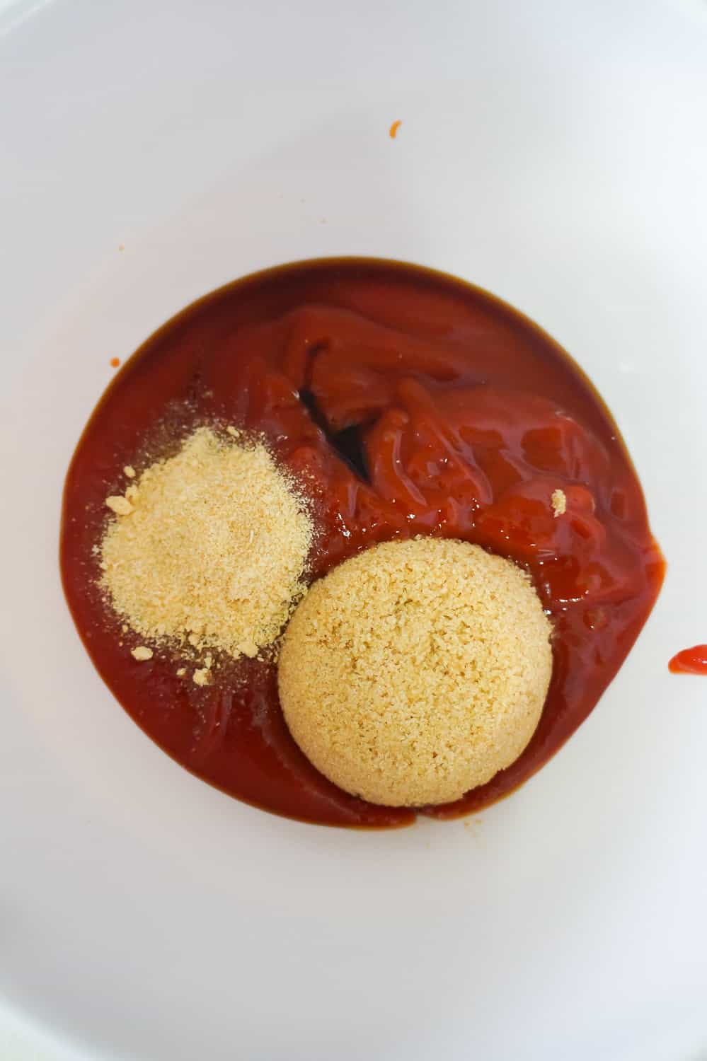 ketchup, brown sugar and onion powder in a mixing bowl